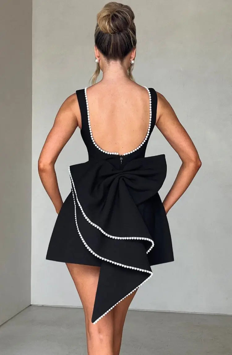 Pearl Trim Sleeveless Slim Fit Mini Dress with Statement Bow Back