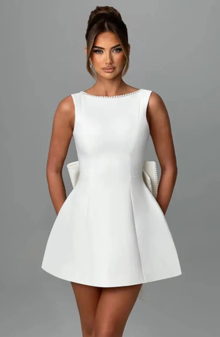 Pearl Trim Sleeveless Slim Fit Mini Dress with Statement Bow Back