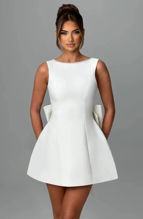 Pearl Trim Sleeveless Slim Fit Mini Dress with Statement Bow Back
