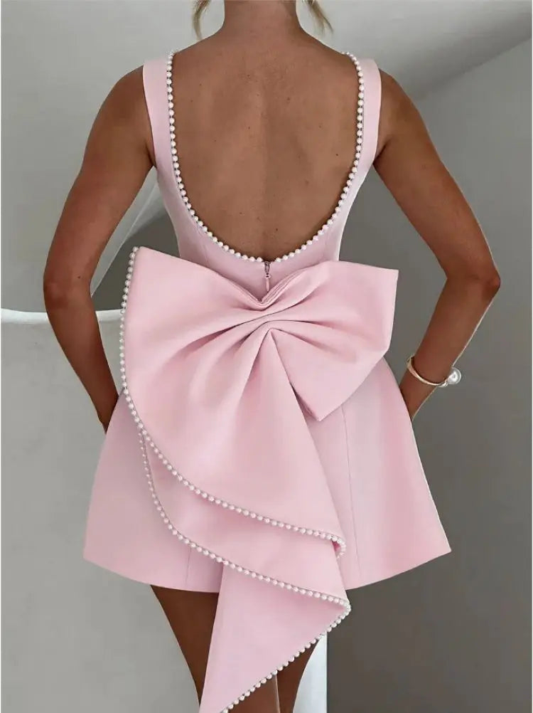 Pearl Trim Sleeveless Slim Fit Mini Dress with Statement Bow Back
