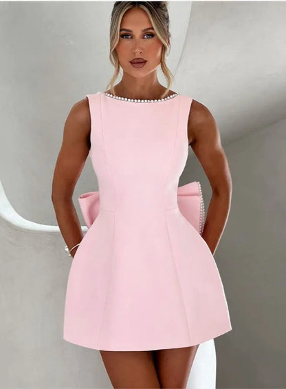 Pearl Trim Sleeveless Slim Fit Mini Dress with Statement Bow Back