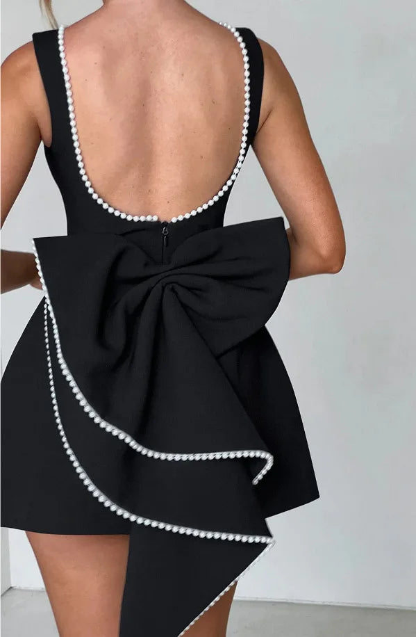 Pearl Trim Sleeveless Slim Fit Mini Dress with Statement Bow Back