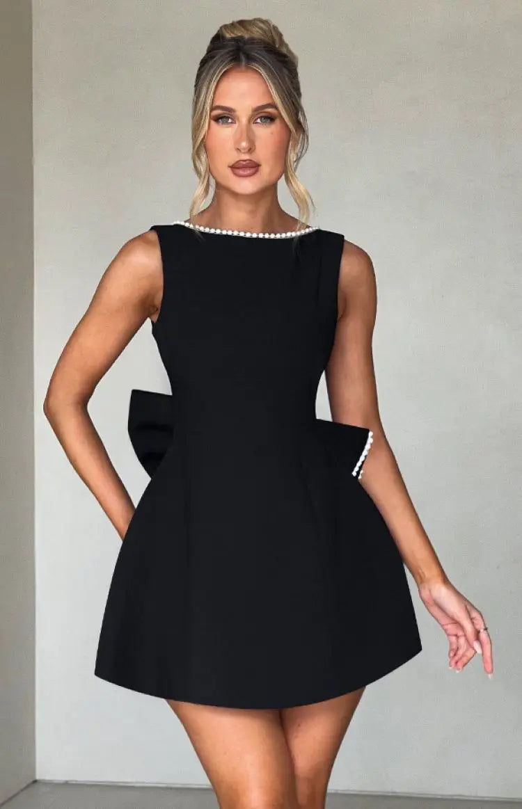 Pearl Trim Sleeveless Slim Fit Mini Dress with Statement Bow Back