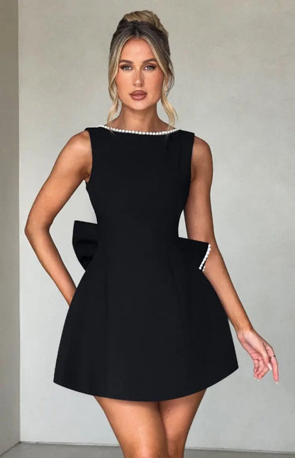 Pearl Trim Sleeveless Slim Fit Mini Dress with Statement Bow Back